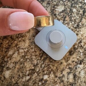 Oura Gold Ring with Charging Base